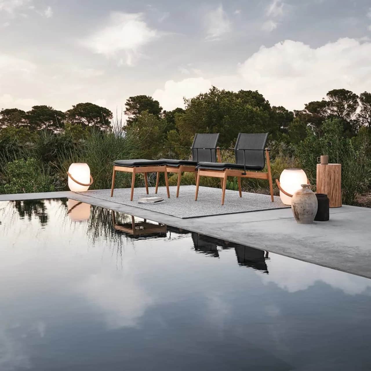 Gloster Sway Lounge Chair & Ottoman | Block Side Table | Ambient Cocoon Outdoor Light