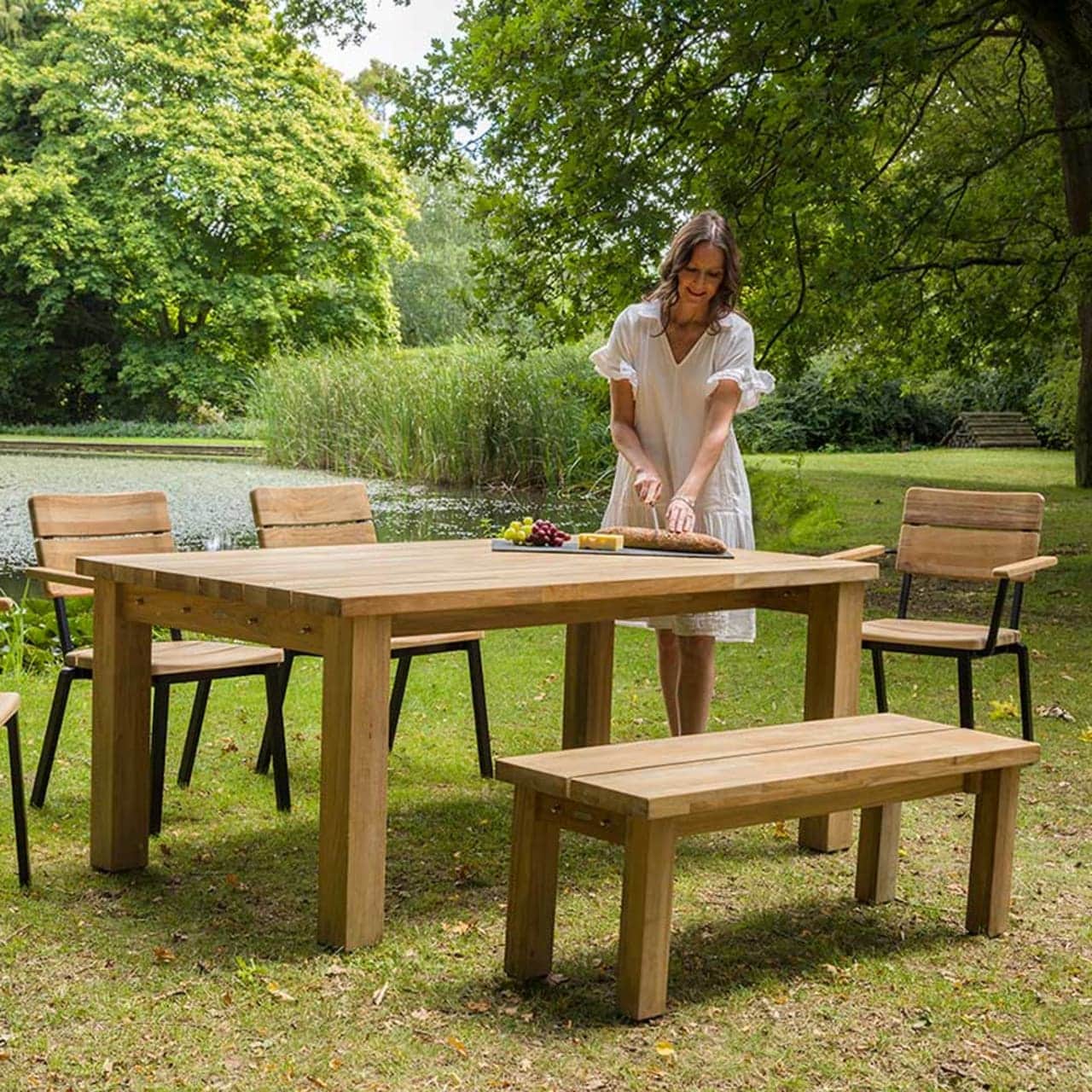 Barlow Tyrie Titan Stacking Rustic Teak Armchairs and 51" Dining Bench with 71" Dining Table