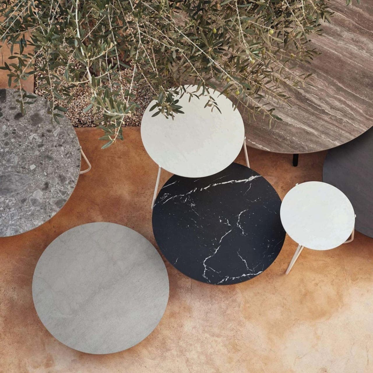 nesting tables: mix and match mood low tables to make a bold statement with different materials