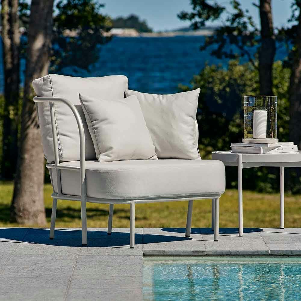relaxing by the pool: salto lounge chair and lounge table with skargaarden's moja lantern
