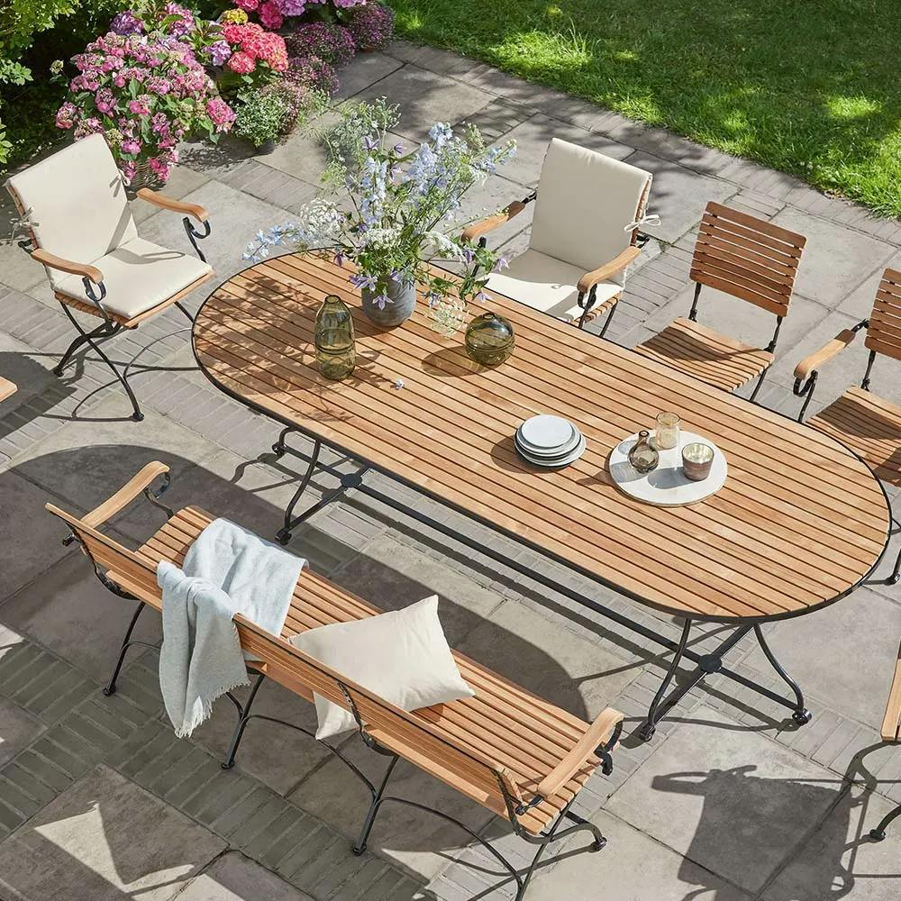 garden party: the fontenay 102" oval table provides comfortable space for up to 10 diners