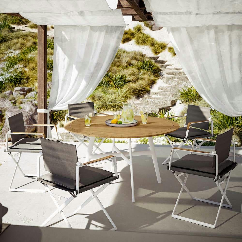 Armchairs with teak armrests [Sail Shade Sling and White Frame] for informal dining (Courtesy of DEDON)