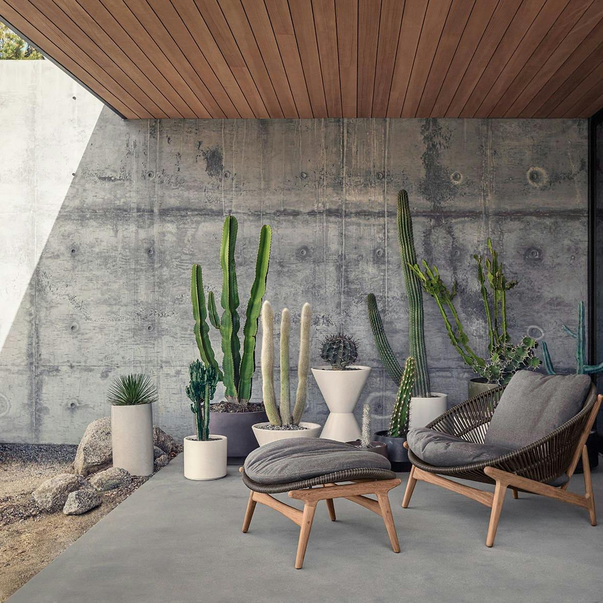 Gloster Bora Lounge Chair outside of a porch under a roof