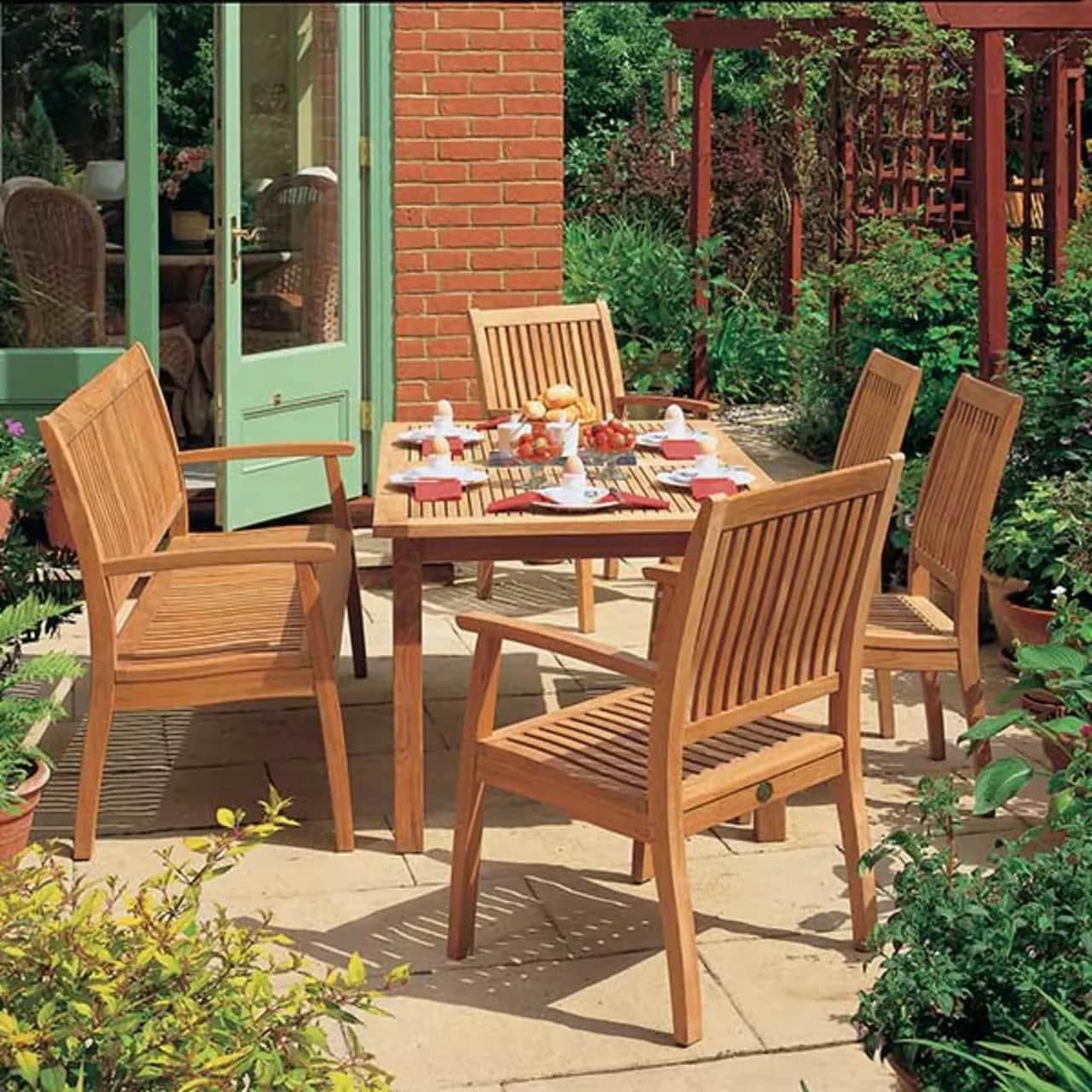 monaco 57" bench, two monaco armchairs and two side chairs around the monaco 59" dining table