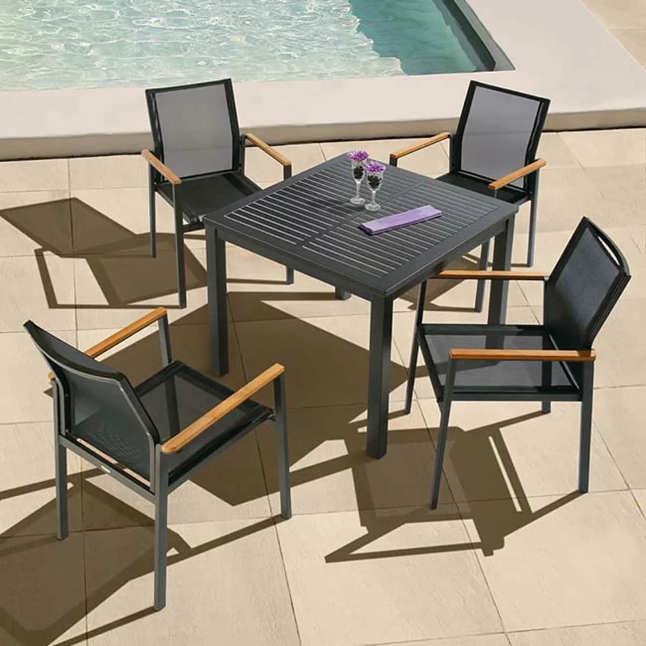 light movable pool setting: aura 35" square all aluminum dining table paired with four aura stacking armchairs (powder-coated aluminum frame, graphite