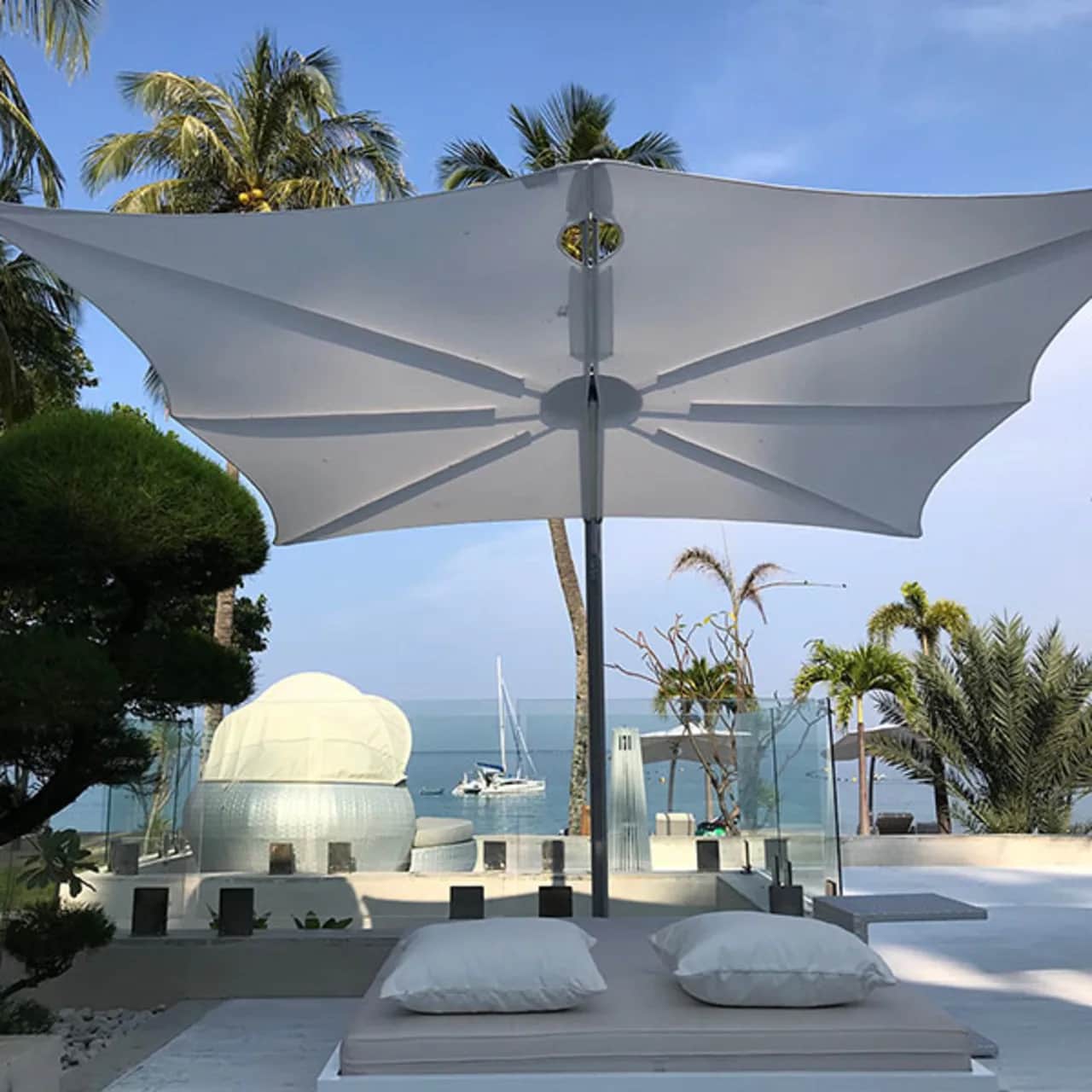 Umbrosa Spectra 9'10" Cantilever Umbrella | Forward 80° | Natural Canvas