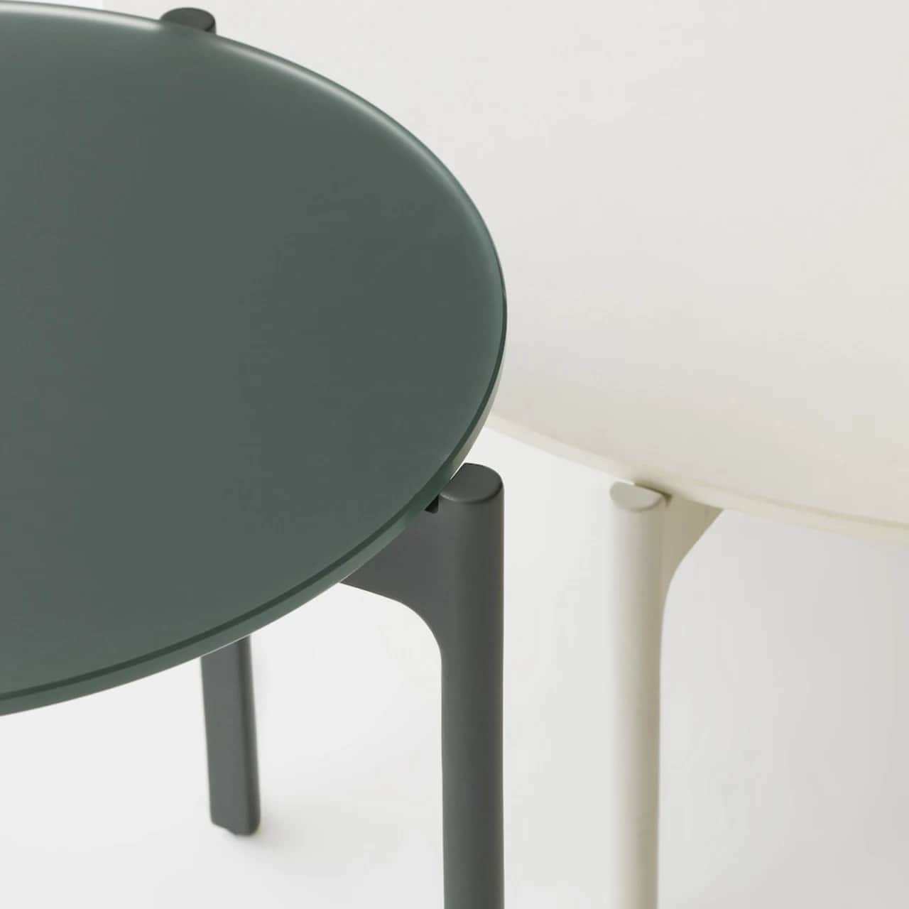 Overlapping Nori Glass Side Table and Lipari/White HPL Coffee Table (Courtesy of DEDON)