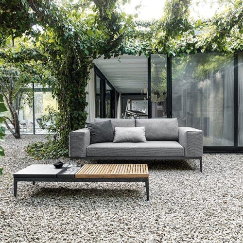 grid sofa with 60" coffee table (teak/ stone top); throw pillows opt. </br><i>image provided courtesy of gloster furniture, inc.</i>