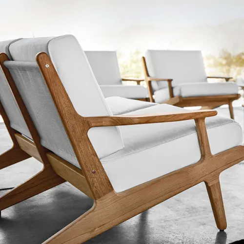 bay detail: cushions with welt and rounded teak frames