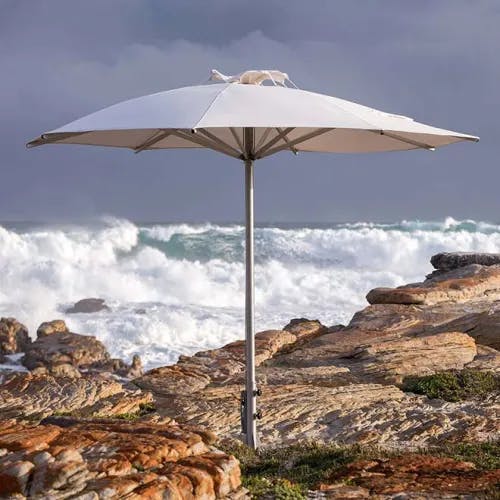 dramatic ambience: storm center pole umbrella tested by nature's fury around the cape of good hope, south africa