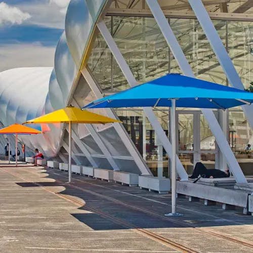 setting fun color accents: nova 13' square giant patio umbrella in pacific blue, sunflower yellow, orange and ...