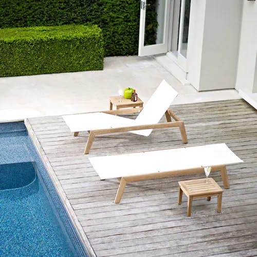 2 solana sling loungers w/ gloster standards medium 22" side table<br><i>image provided courtesy of gloster furniture, inc.</i>