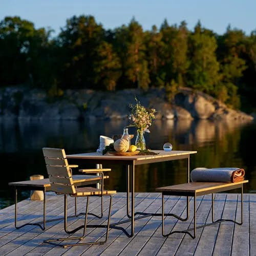 a spot by the lake: grinda 59" dining table with two grinda benches and grinda armchair