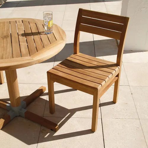 enjoy a drink in the sun: bermuda 35" round dining table w/ bermuda dining side chair