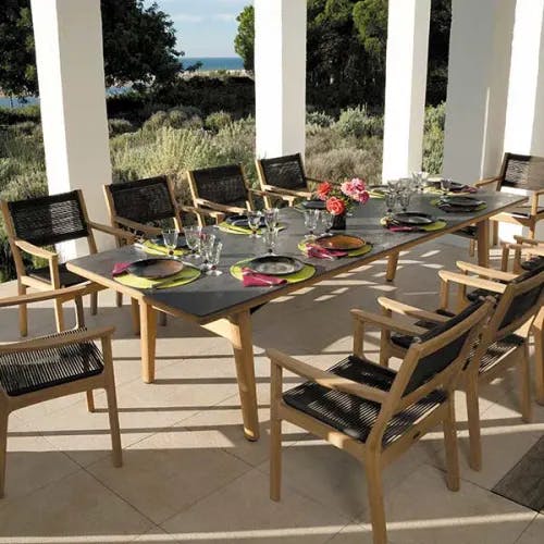 entertaining large parties: monterey armchairs (teak with karub-brown textilene cord) harmonizing with teak-ceramic dining table