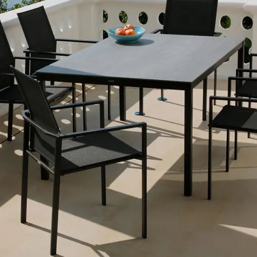 in sync: equinox 59" table fits nicely up to six people (finishes: graphite/ carbon/ dusk)