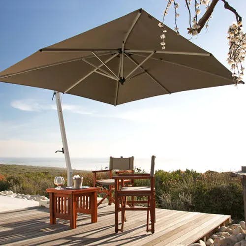 spacious shade: 9.8' picollo square cantilever umbrella with sunbrella heather beige canopy