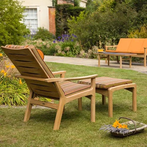 garden retreat: monterey teak deep-seating armchair, teak ottoman and teak 3-seater settee with optional cushions
