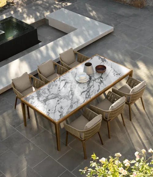classic italian look: the cruise dining table has a stunning porcelain stoneware top in the style of capraia marble