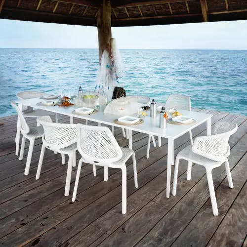 Beach Dining at its Finest: Stackable Armchairs and Side Chairs [Chalk] (Courtesy of DEDON)