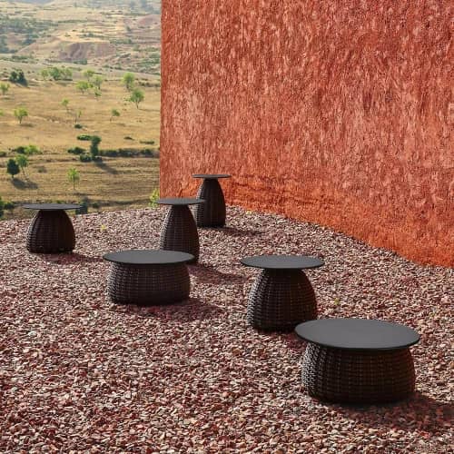 PORCINI tables with Marrone fiber and black ceramic table top (Photo courtesy of DEDON)