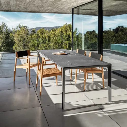 carver nero ceramic dining table with archi dining chairs