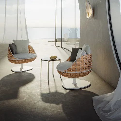 Seating for one: SWINGREST Lounge chairs and an IZON side table (Photo courtesy of DEDON)