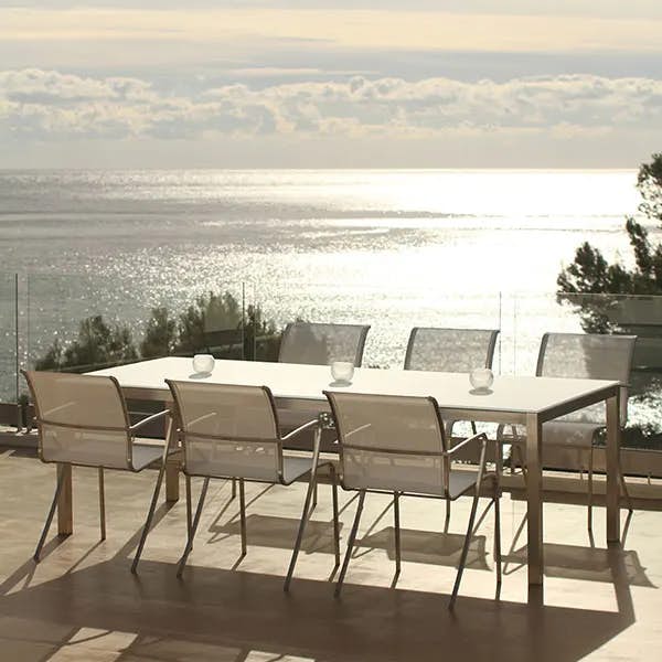 taboela dining table (frame: stainless steel; top: ceramic) paired w/ six alura armchairs