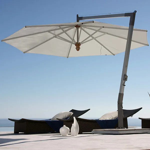 shaded respite: pendulum 13.1' round cantilever umbrella with sunbrella canvas canopy
