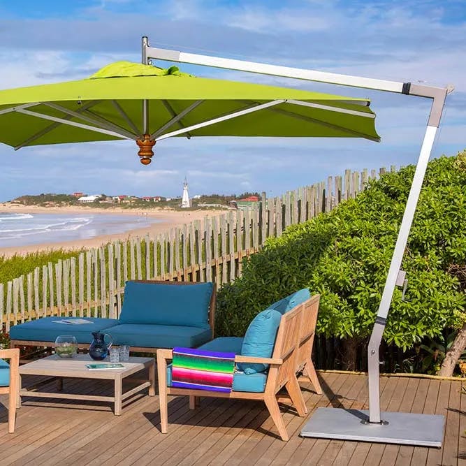 first row shaded seating: pendulum 11.5' square cantilever umbrella with sunbrella macao canopy