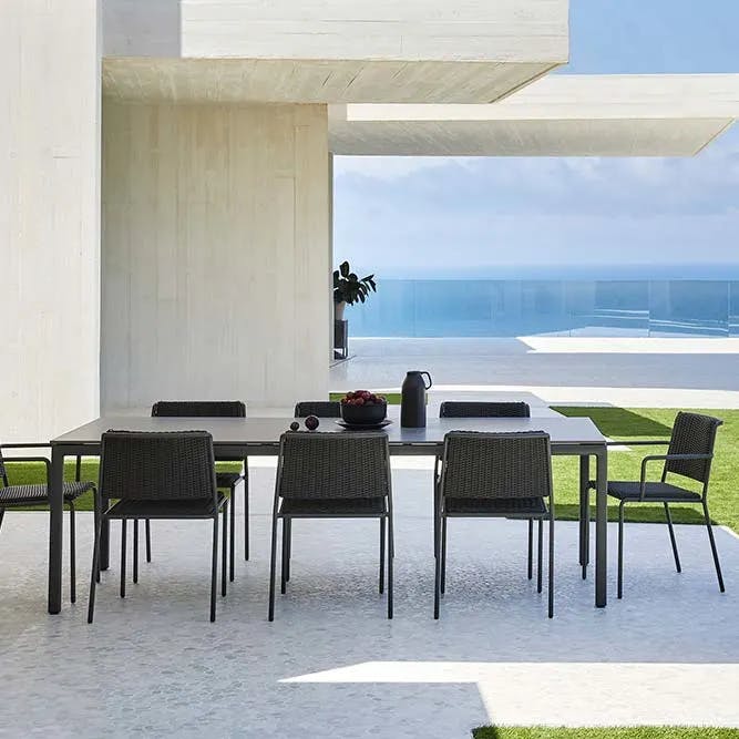 all in one tone: two summer dining armchairs and six side chairs with 95" dining table (aluminum finish: gunmetal grey