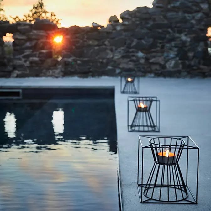framing your pool: boo candle holders lined up
