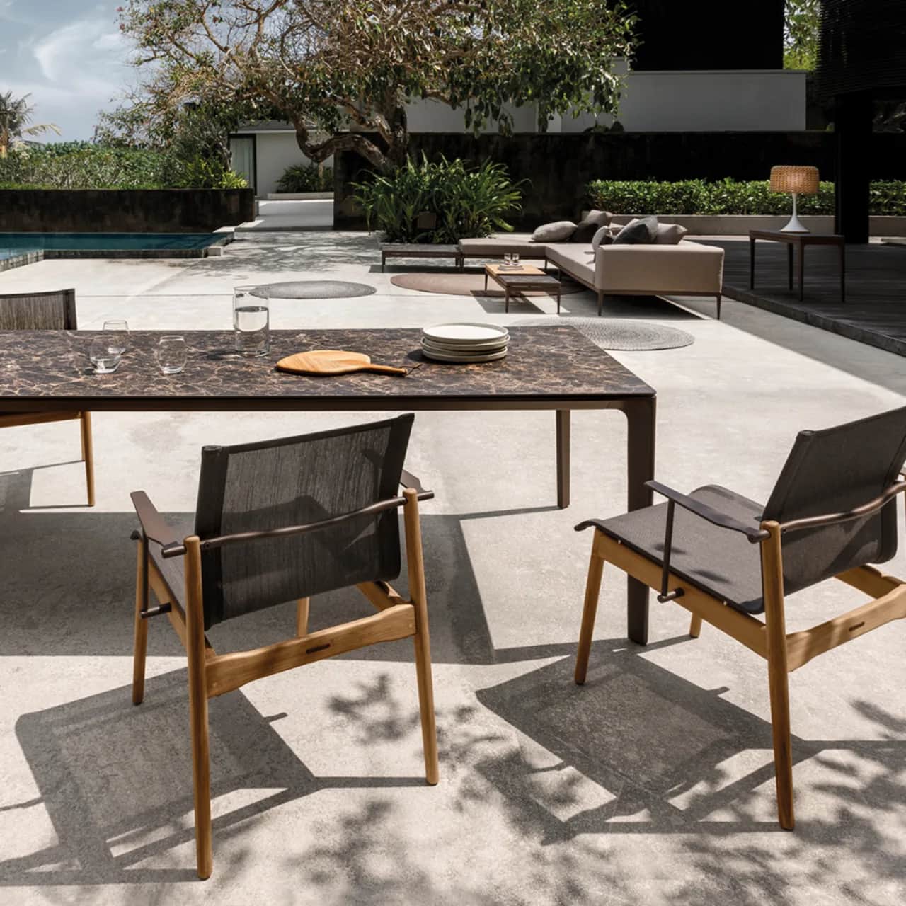 Gloster Carver 87" Dining Table (Java, Emperor) with Stacking Dining Armchair (Java, Sepia)