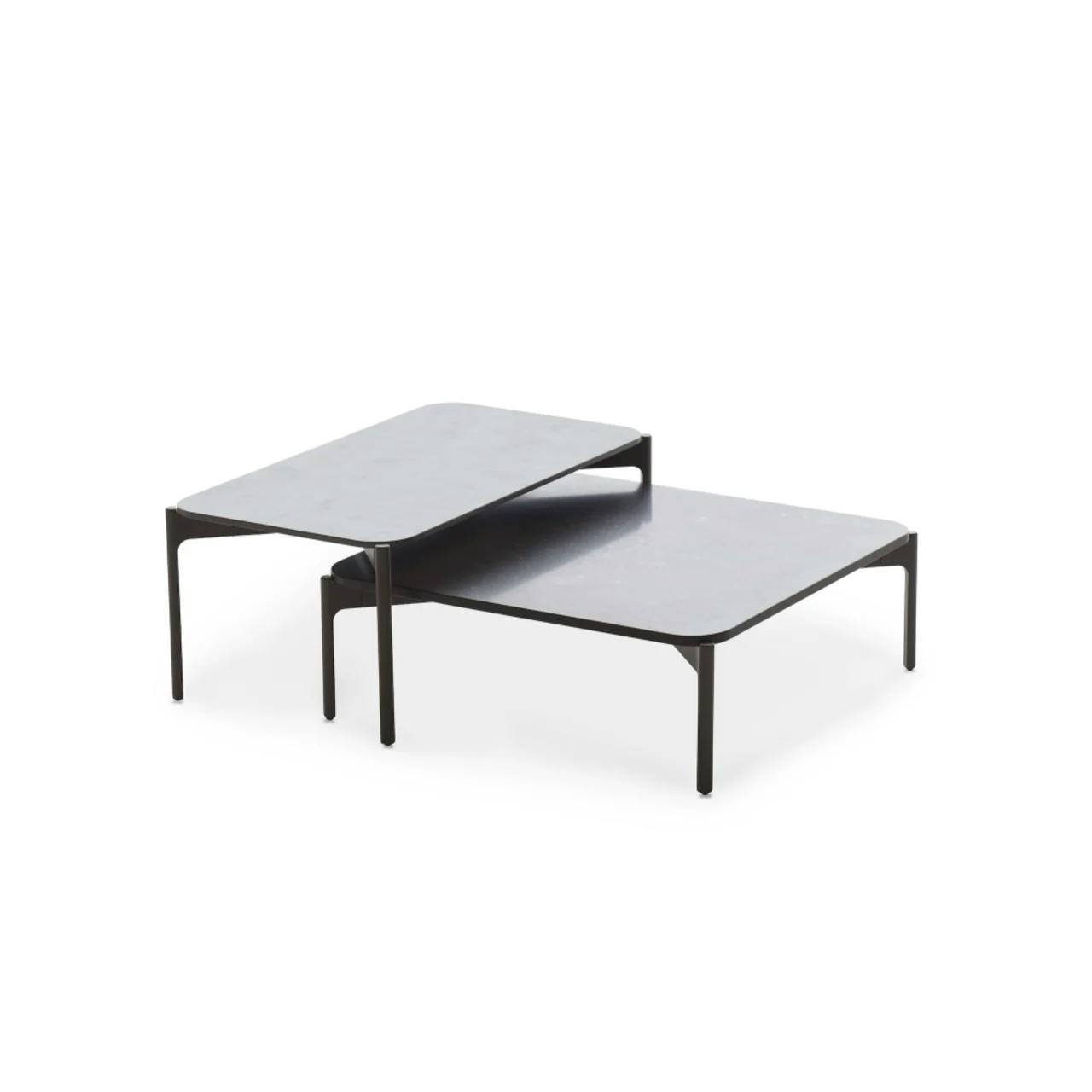 Overlapping Coffee Tables [Black Pepper and Lava Mineral Composite] (Courtesy of DEDON)