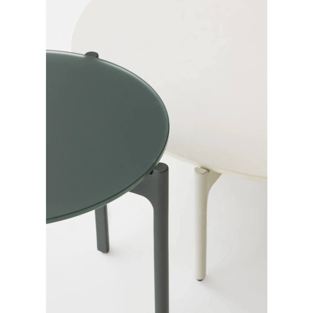 Overlapping Nori Glass Side Table and Lipari/White HPL Coffee Table (Courtesy of DEDON)