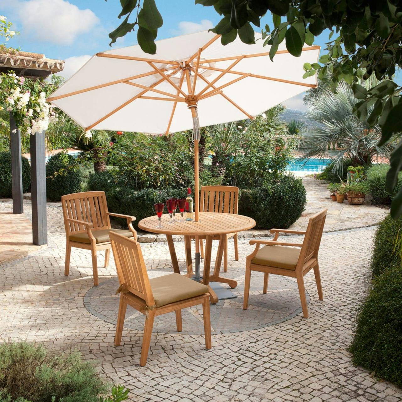 Barlow Tyrie Chesapeake Side Chairs and Armchairs with Chesapeake 45" Round Dining Table and Napoli 9'2" Tilting Umbrella