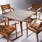 a table for four: four monterey all teak armchairs paired with monterey's 40" dining table with a frost ceramic tabletop