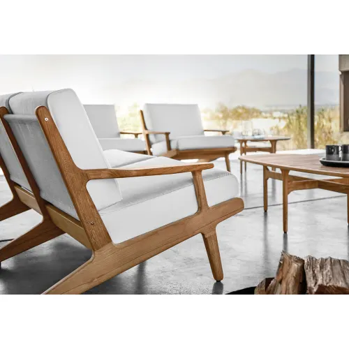 bay detail: cushions with welt and rounded teak frames