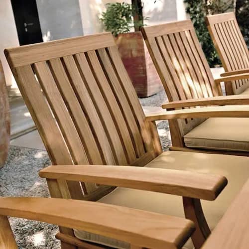 close-up: craftsmanship of ventura's teak dining armchairs with optional notched seat cushion (upcharge applies)