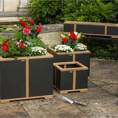 beautify your outdoors: barlow tyrie's aura planters in square (front) and rectangular (back)