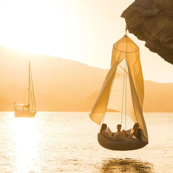 DEDON Island: A SWINGREST Hanging Lounger with canopy is the ultimate hanging lounge system (Photo courtesy of DEDON)
