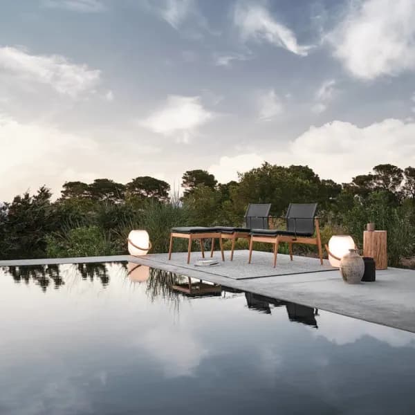 Gloster Sway Lounge Chair & Ottoman | Block Side Table | Ambient Cocoon Outdoor Light