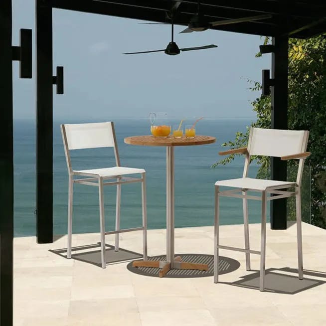 cocktail for two: equinox high-dining carver and high-dining side chair with 27" round pedestal table