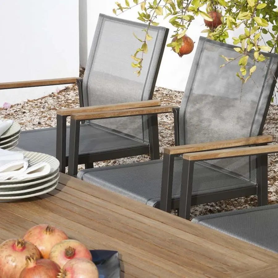 Barlow Tyrie Aura dining armchairs | Teak armrests | Charcoal Sling
