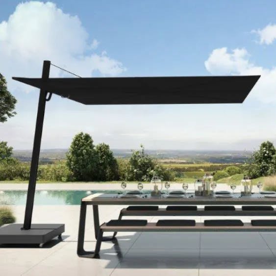 expansive shade: Versa UX Black cantilever umbrella provides generous shade covering in outdoor areas